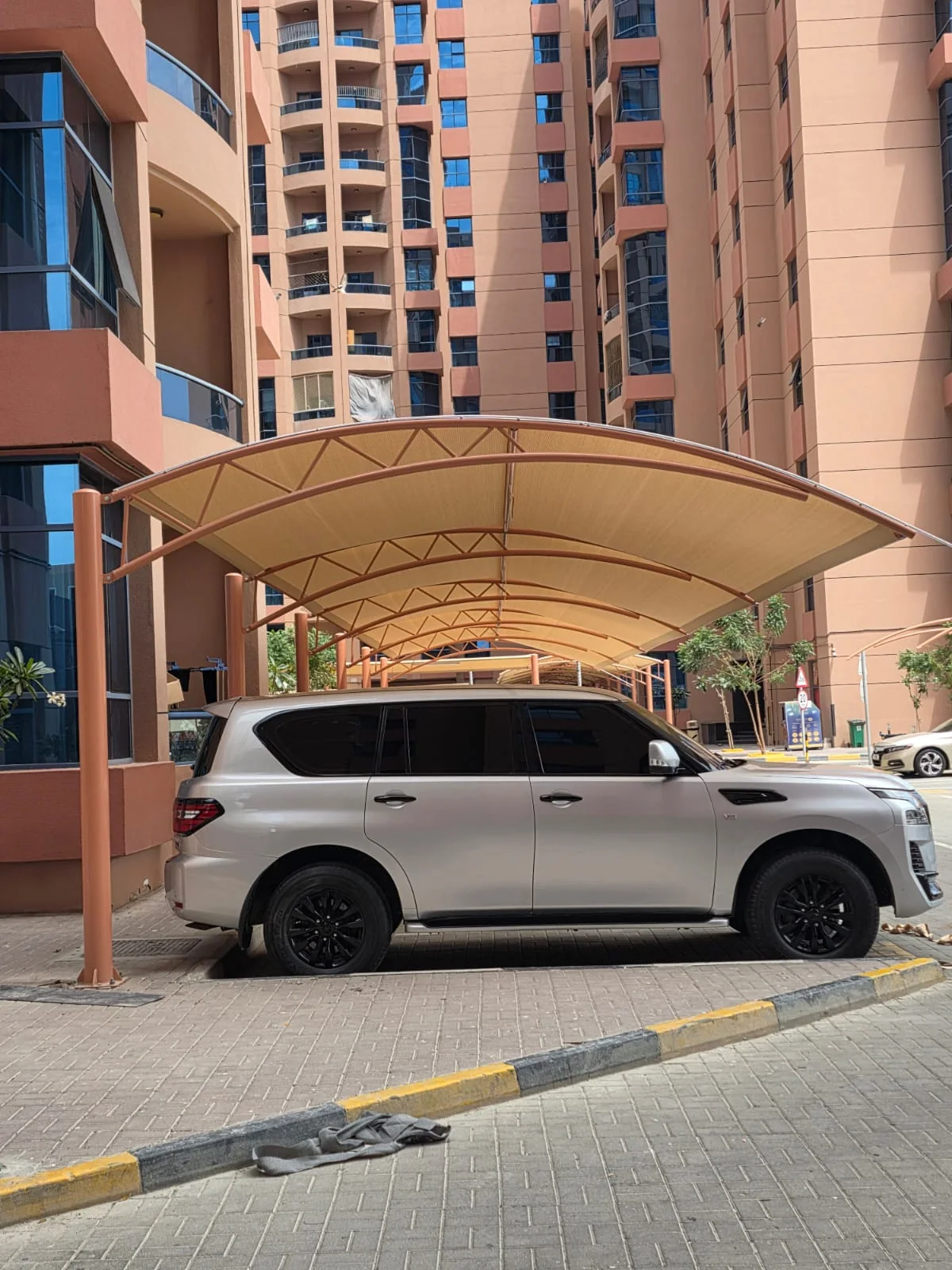 Completed car parking shade structure at Al Nuaimiya Tower in Ajman — installation view 3