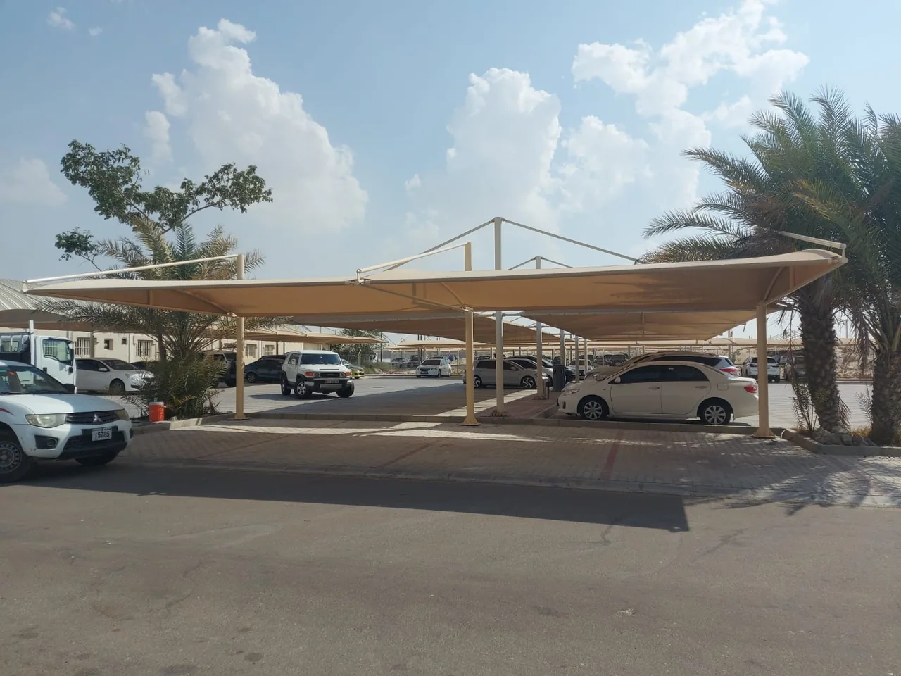 Completed car parking shade structure at Al Tawazan Industrial Area in United Arab Emirates — installation view 4