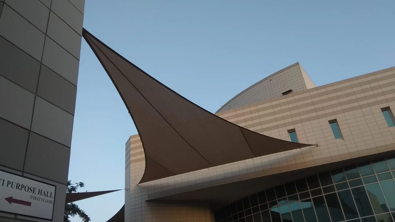 Completed tensile membrane shade structure at HCT Al Nahda in Dubai — installation view 3